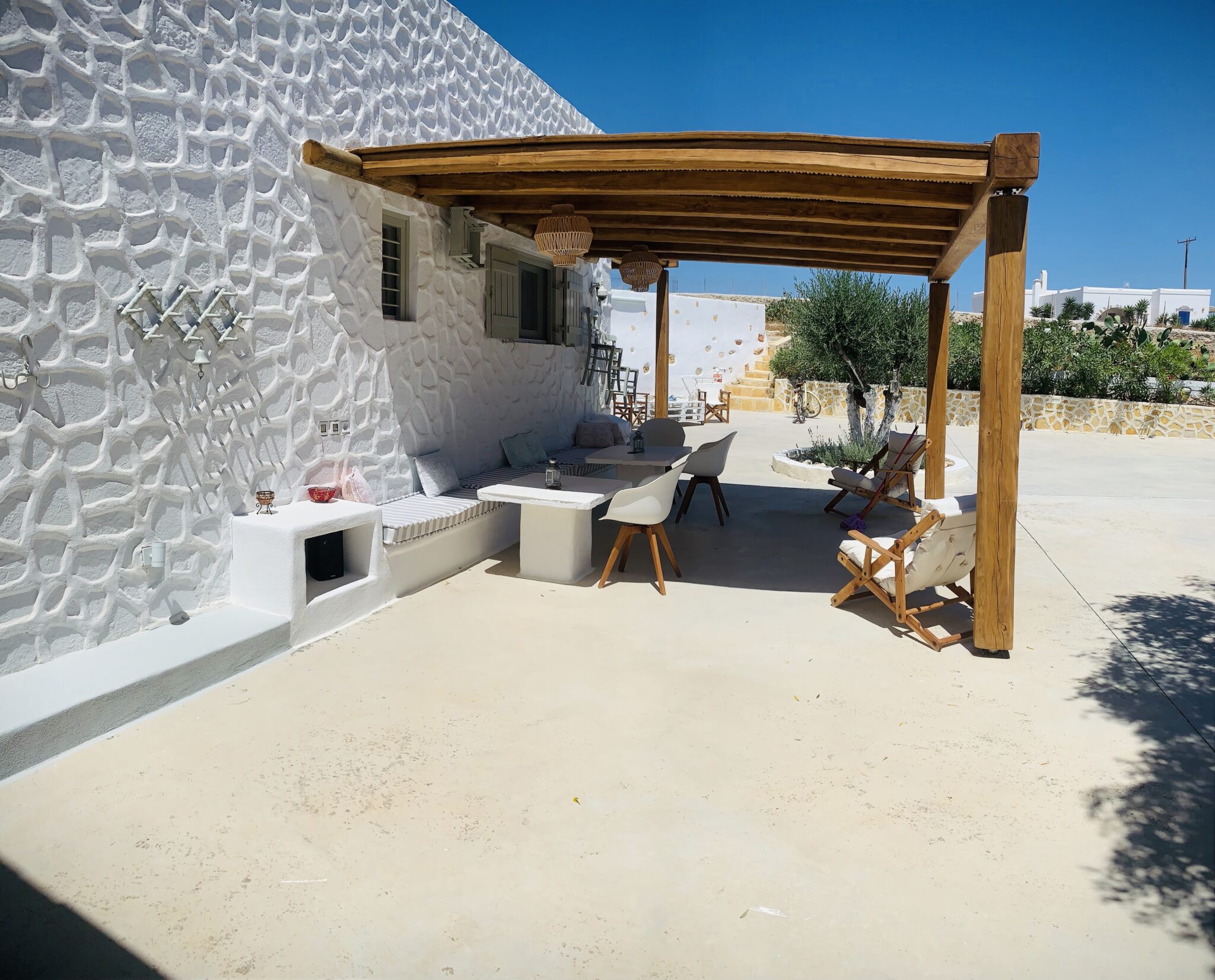 Outdoor dining table under the pergola