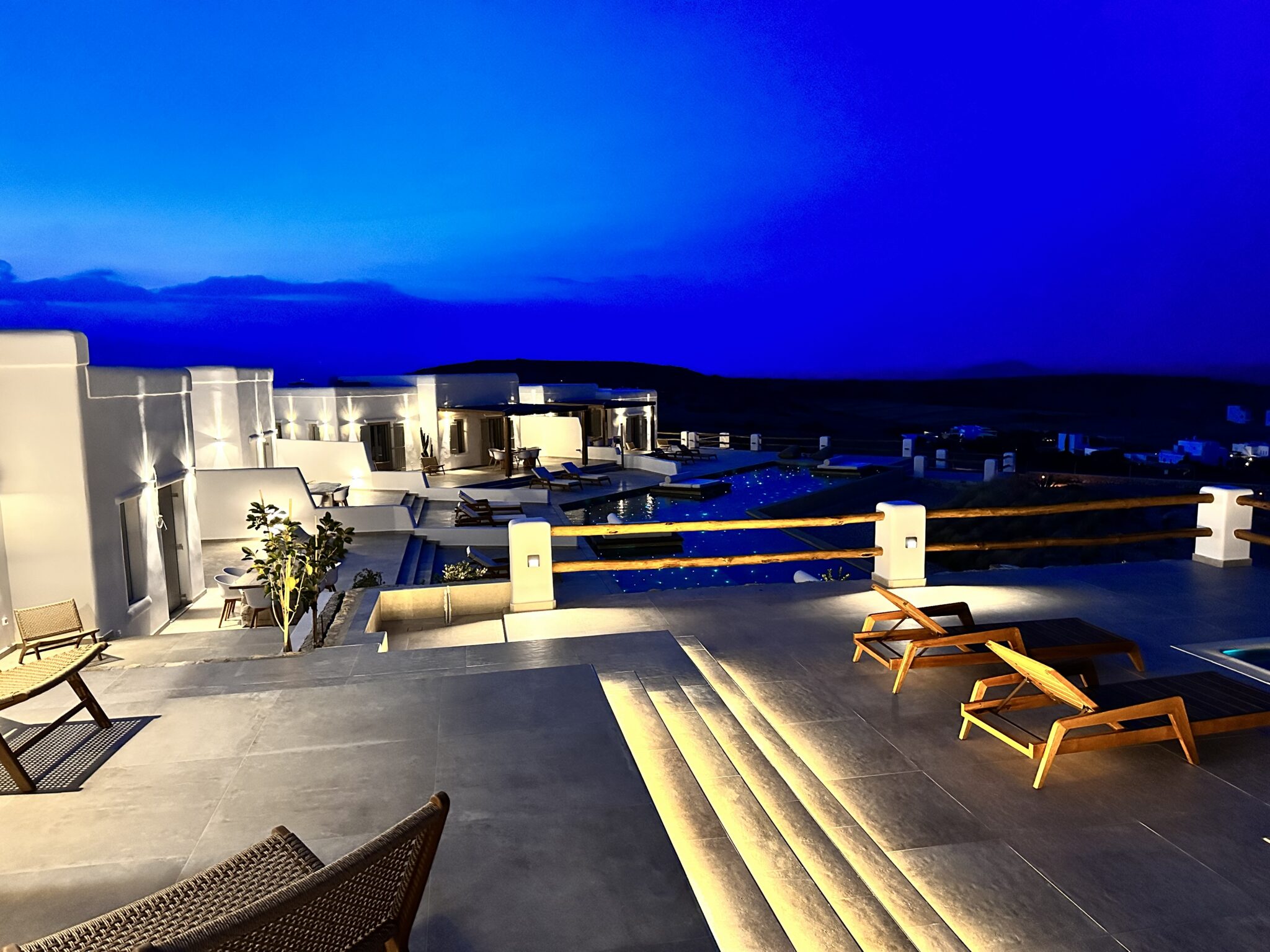 Villa with Private Pool & Jacuzzi at dusk – terrace steps and pool with Pori Beach beyond