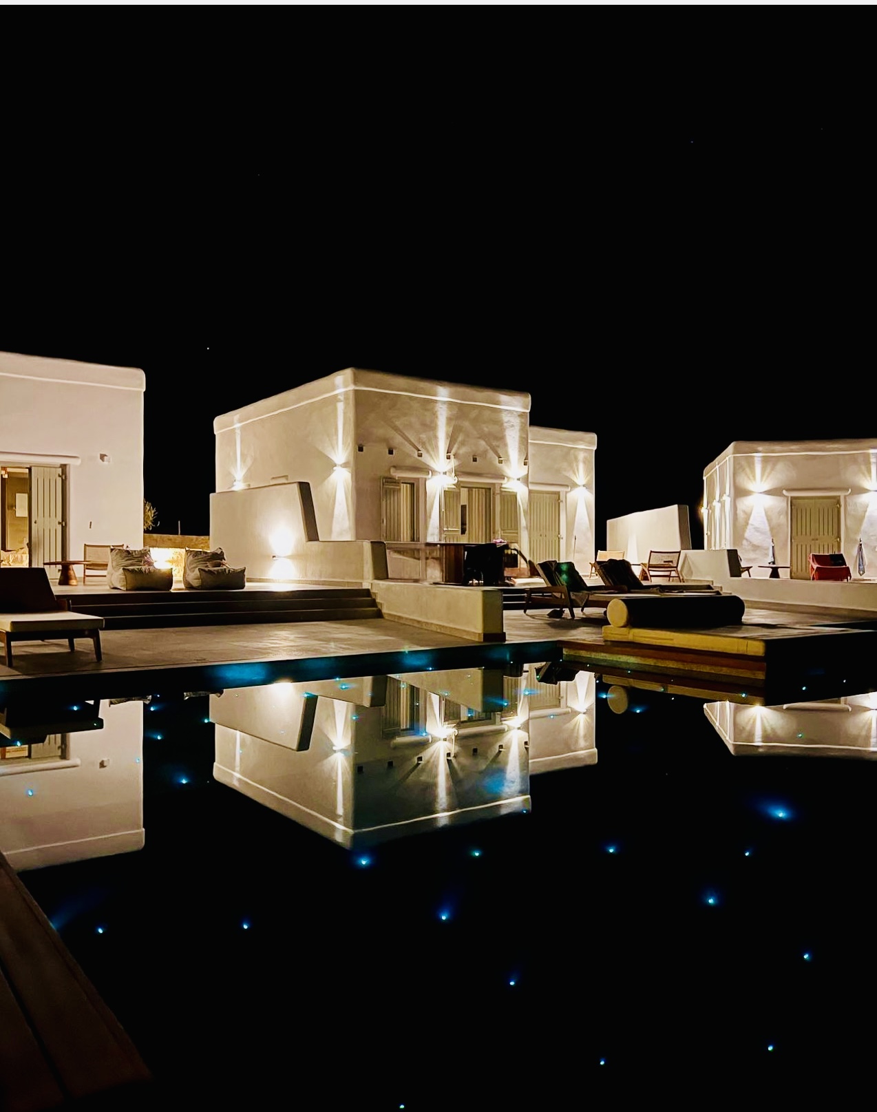 Villa with Semi-private Pool at night – lit villas reflected in the pool